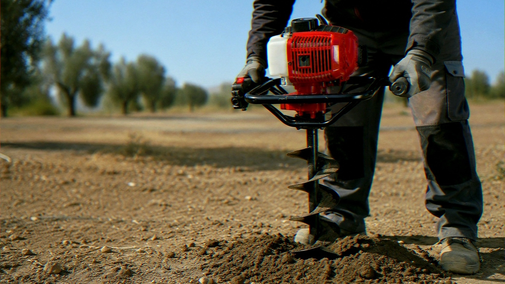 Why Does an Earth Auger Engine Stop When Drilling Into Hard Ground?